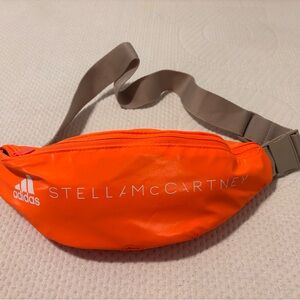 New Adidas by Stella McCartney orange belt bag with tan strap and interior.